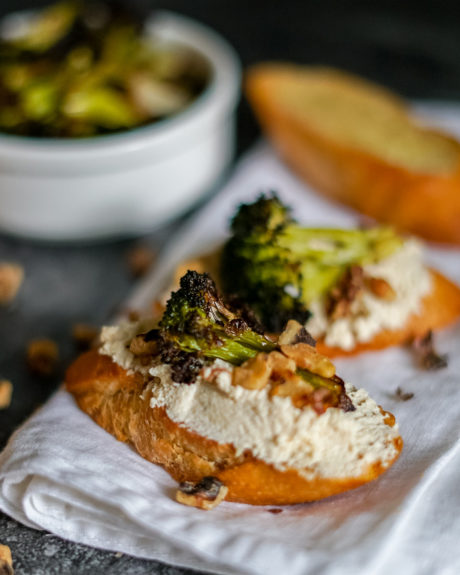 vegan ricotta toast with broccoli and garlic garnish